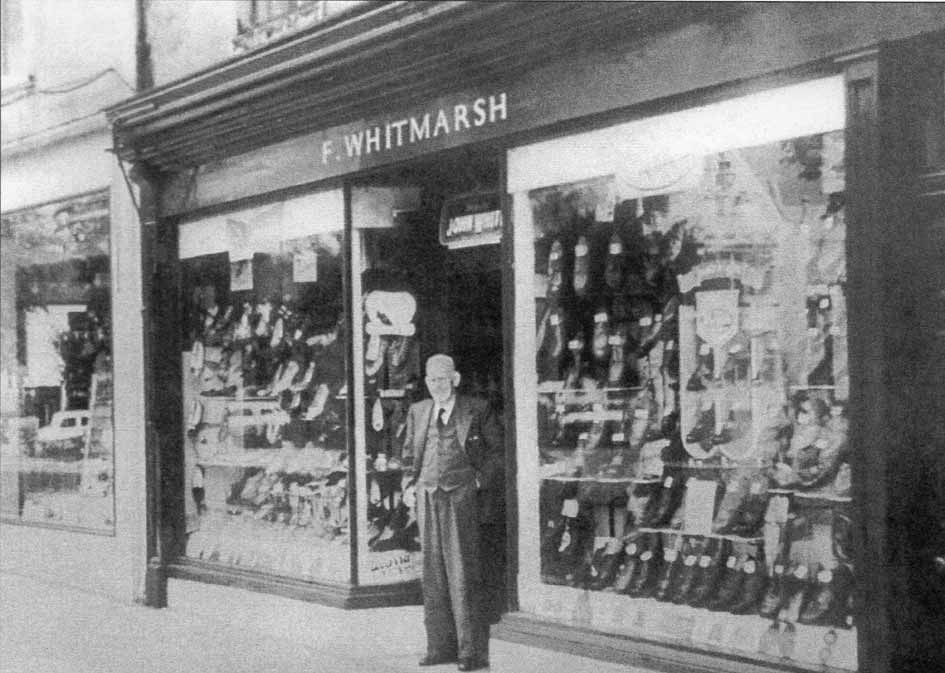 Mr. Whitmarsh outside his shop on Church Walk